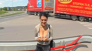 Sexy Brunette Blows A Truck Drivers Dong In A Parking Lot