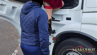 A nasty MILF shows off in a truck stop parking lot and gets hammered by a trucker