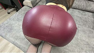 A big butt in a red leather skirt was pulled onto a stud's rod!